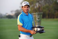 LIMA, PERU NOVEMBER 10: Julián Etulain of Argentina poses with the trophy following his victory at the 2013 Lexus Peru Open at Los Inkas Golf Club in Lima, Peru on November 10, 2013. This was Etulain's first career win on NEC Series PGA TOUR Latinoamérica. Photo Credit: Enrique Berardi/PGA TOUR