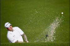 Hass adelante por uno luego de la 1ra ronda (cortesía Harry How, David Cannon, Rob Carr & Andrew Redington / Getty Images)