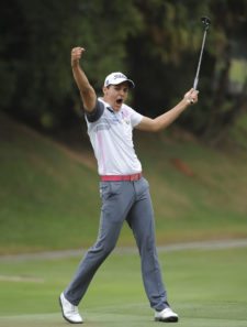 RIO DE JANEIRO, BRASIL - NOVEMBER 9: Rafael Becker of Brazil waves to the gallery of fans after making a eagle on the 18th hole green during the final round of the Aberto do Brasil/Aberto do Atlantico presented by Credit Suisse Hedging-Griffo at Gavea Golf and Country Club on November 9, 2014 in Rio de Janeiro, Brazil. (Enrique Berardi/PGA TOUR)