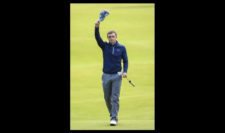 Amateur Paul Dunne of Ireland waves to the crowd on the 18th green during the third round (Photo by Andrew Redington-Getty Images)