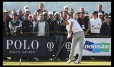 Dustin Johnson of the United States tees off on the 13th hole during the third round (Photo by Mike Ehrmann-Getty Images)