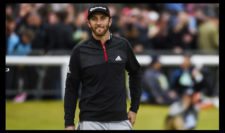 Dustin Johnson of the United States walks across the 18th green during the third round (Photo by Ross Kinnaird-R&A-R&A via Getty Images)