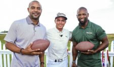 Former Green Bay Packers Antonio Freeman (L) and Ahman Green (R) take part in the Mercedes-Benz Hole-In-One Challenge with Rickie Fowler(C) of the United States during a practice round prior to the 2015 PGA Championship at Whistling Straits