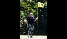 John Daly of the United States holds a pin on the ninth green during a practice round prior to the 2015 PGA Championship at Whistling Straits on August 11, 2015 in Sheboygan, Wisconsin (Photo by Jamie Squire/Getty Images)